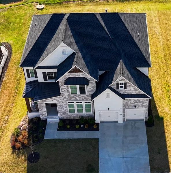 Front exterior of a new home in , Woodstock, GA, highlighting curb appeal (Image 20).