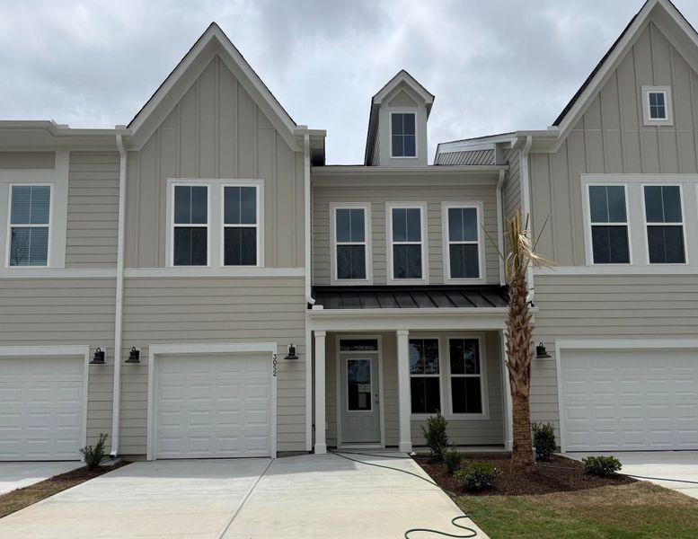 Front exterior of a new home in Grand Park, Leland, NC, highlighting curb appeal (Image 1). Front exterior of a new home in Grand Park, Leland, NC, highlighting curb appeal (Image 1).