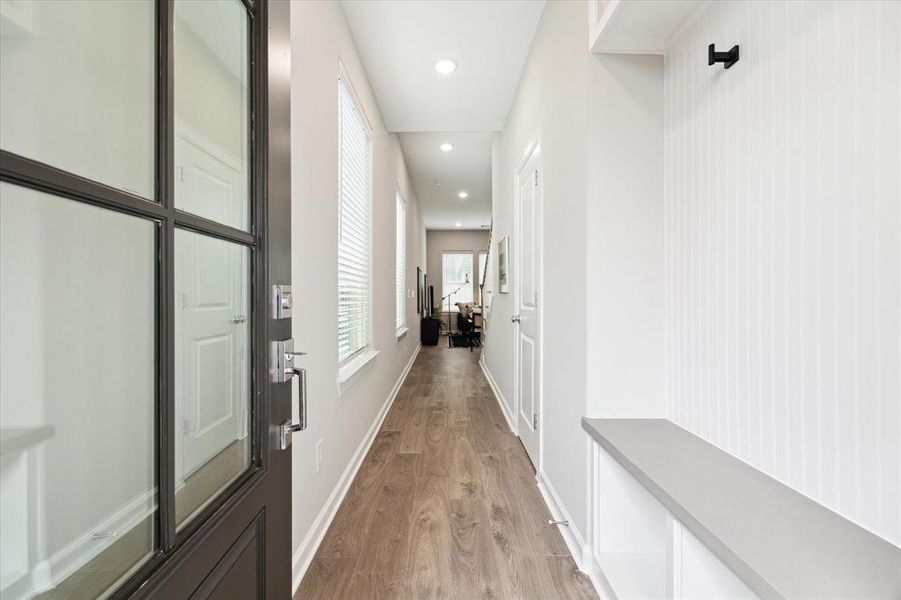 Step into a warm and inviting formal entry designed with both style and functionality in mind. Thoughtfully crafted built-in storage provides the perfect space to keep everyday essentials neatly organized—whether it’s coats, shoes, or decorative accents