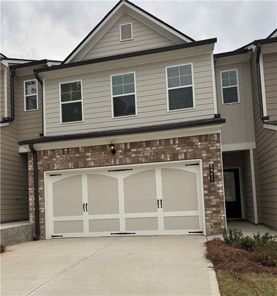 Front exterior of a new home in Mulberry Summit, Flowery Branch, GA, highlighting curb appeal (Image 1).