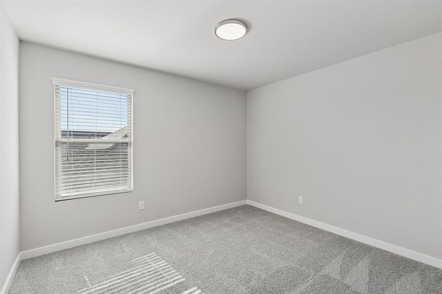 Bedroom in the Holden home plan by Trophy Signature Homes – REPRESENTATIVE PHOTO Bedroom in the Holden home plan by Trophy Signature Homes – REPRESENTATIVE PHOTO