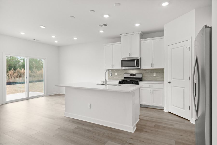 Furnished interior view inside a new home in Cypress Ridge - The Boardwalk Series, Longs (Image 8).