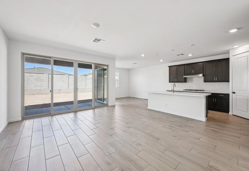 Great room, kitchen and dining. Not actual home, finishes may vary by community. Great room, kitchen and dining. Not actual home, finishes may vary by community.