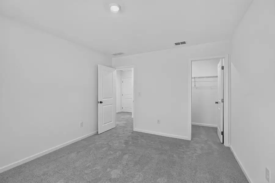 Spacious, unfurnished interior of a new home in Weatherfield, Buford (Image 38).
