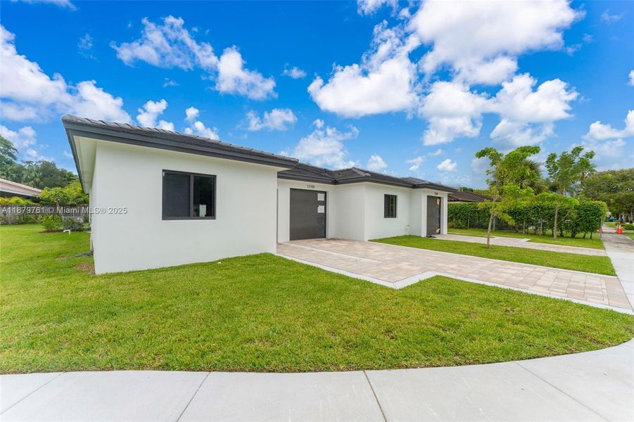 Front exterior of a new home in , Miami, FL, highlighting curb appeal (Image 22). Front exterior of a new home in , Miami, FL, highlighting curb appeal (Image 22).