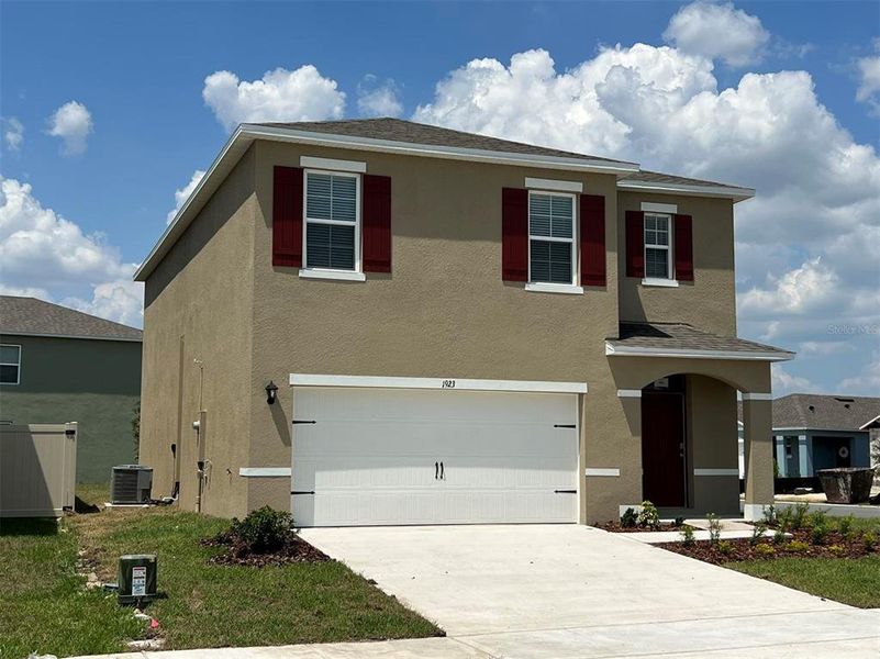 Front exterior of a new home in , Davenport, FL, highlighting curb appeal (Image 2). Front exterior of a new home in , Davenport, FL, highlighting curb appeal (Image 2).