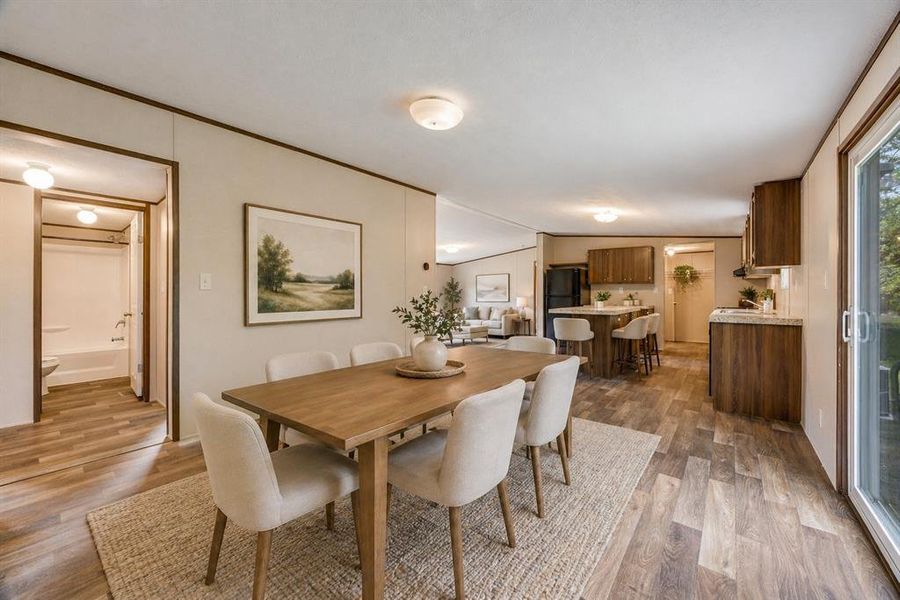 Dining area and kitchen 
Virtually staged.