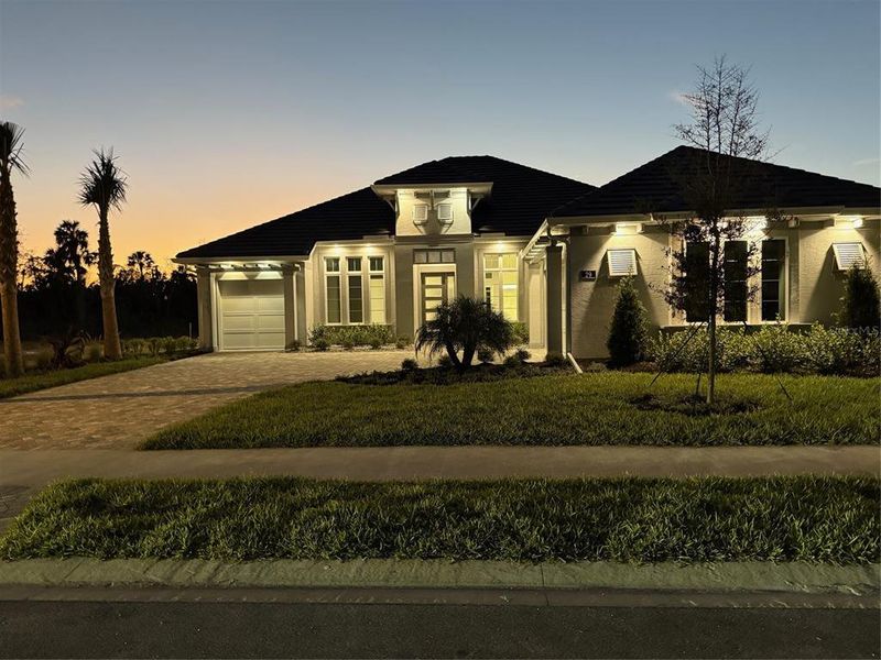 Front exterior of a new home in Veranda Bay, Flagler Beach, FL, highlighting curb appeal (Image 2). Front exterior of a new home in Veranda Bay, Flagler Beach, FL, highlighting curb appeal (Image 2).