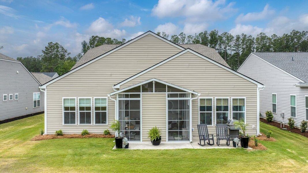Front exterior of a new home in K. Hovnanian's® Four Seasons at Lakes of Cane Bay, Summerville, SC, highlighting curb appeal (Image 2).