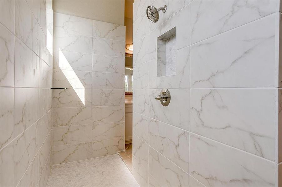 Bathroom with a tile shower