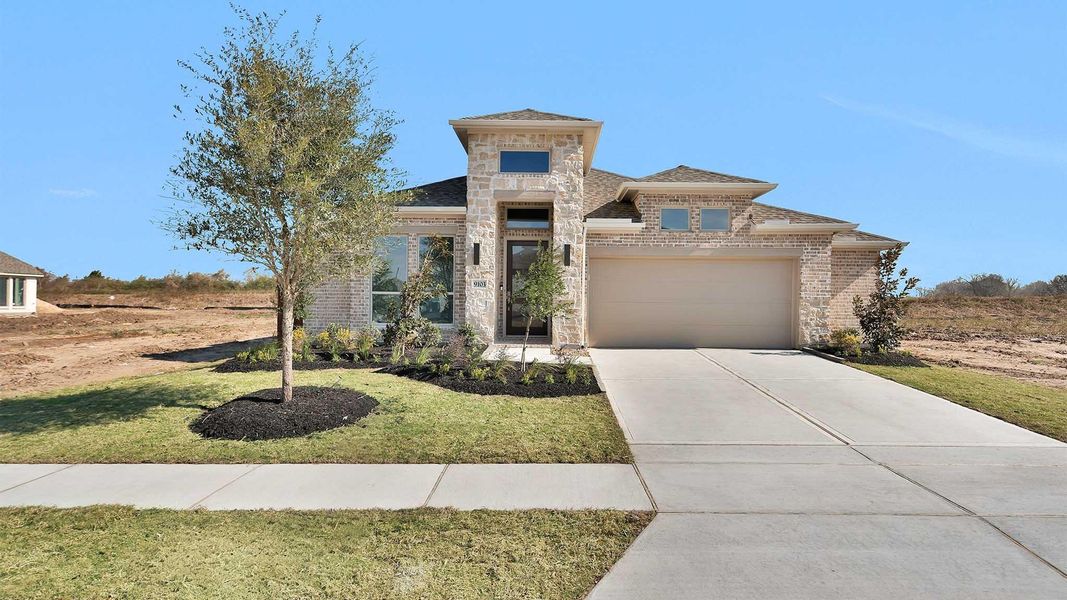 Front exterior of a new home in Meridiana, Manvel, TX, highlighting curb appeal (Image 2).