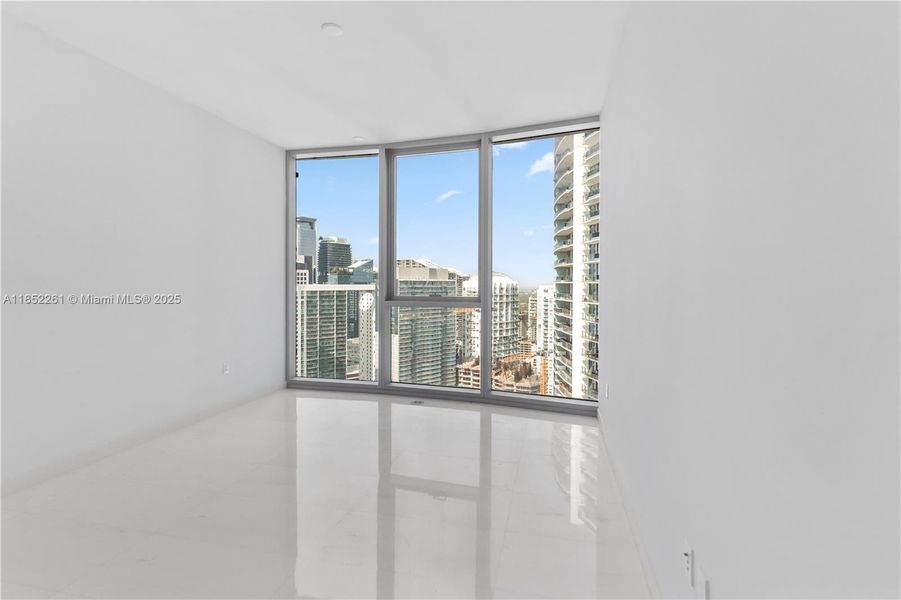 Spacious, unfurnished interior of a new home in Aston Martin Residences, Miami (Image 15).