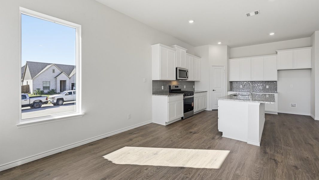 Representative furnished interior of a home built from the Ivery by D.R. Horton in Morning Ridge, Princeton (Image 6).