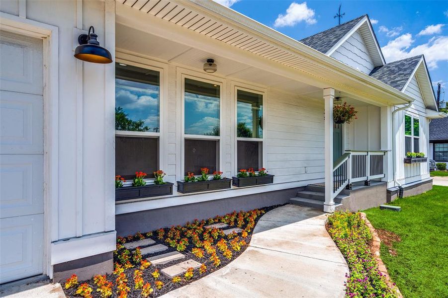 Is there a more welcoming entrance than this charming walk up?  Can you say MASSIVE CURB APPEAL?
Please note... All new windows, roof, sidewalks, porch , railings, door etc....