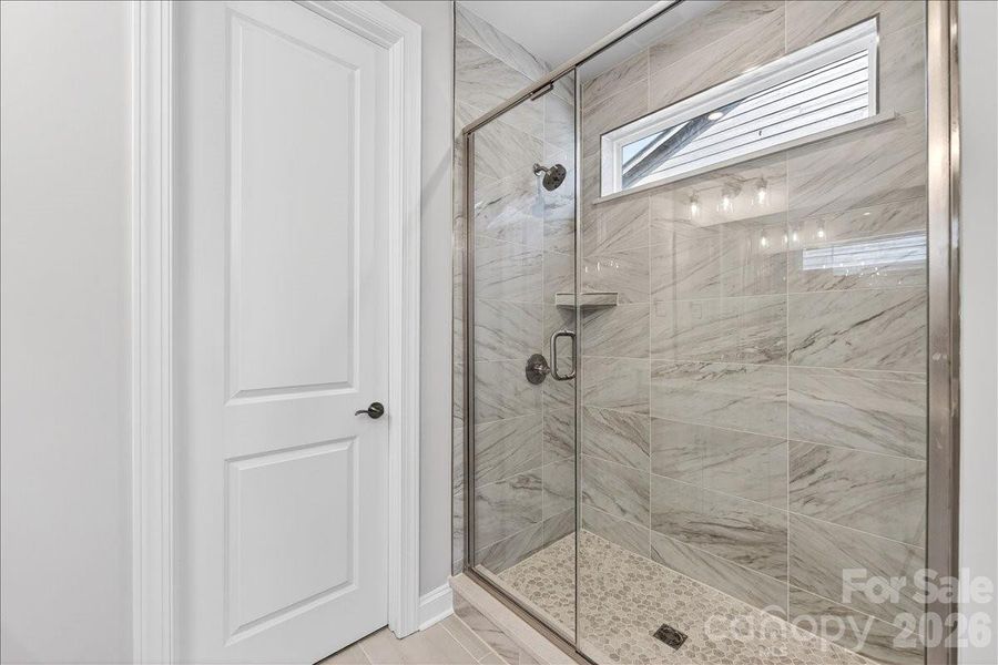Tiled primary walk-in shower