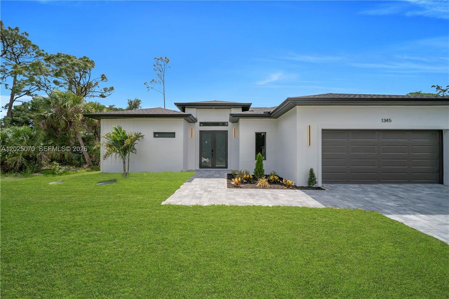 Front exterior of a new home in , North Port, FL, highlighting curb appeal (Image 21).