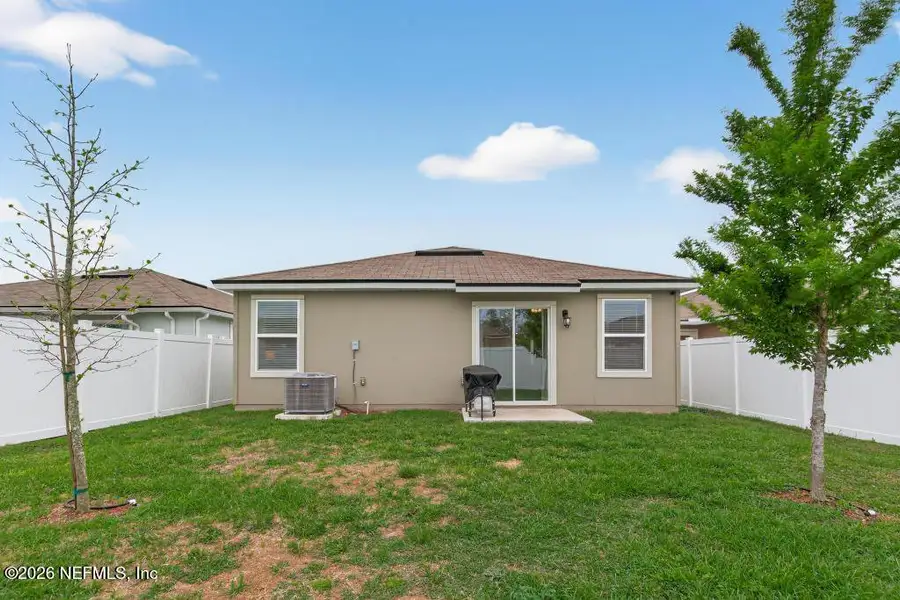 Exterior details and patio area of a home in Cross Creek Express, Green Cove Springs (Image 24).
