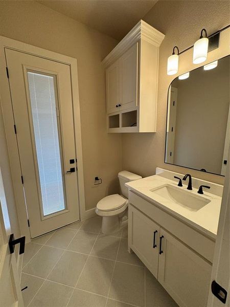 Bathroom with vanity and light tile patterned flooring Bathroom with vanity and light tile patterned flooring