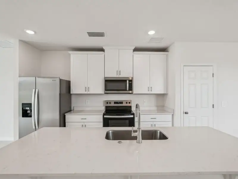 Furnished interior view inside a new home in Springs at Lake Alfred - Classic Series, Lake Alfred (Image 3).
