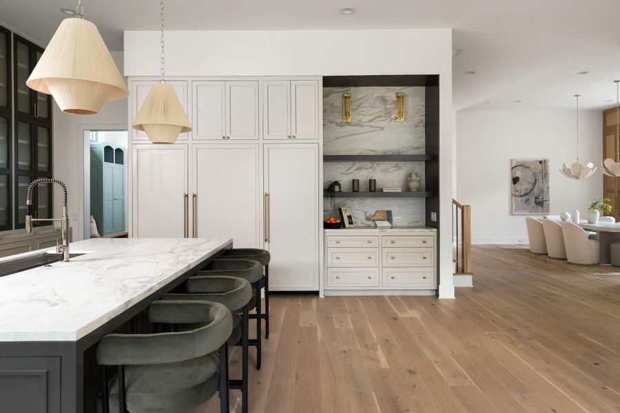 Fully paneled Thermador refrigeration with hidden door to pantry