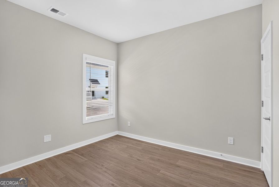Spacious, unfurnished interior of a new home in The Cottages at East Lanier, Fayetteville (Image 19).
