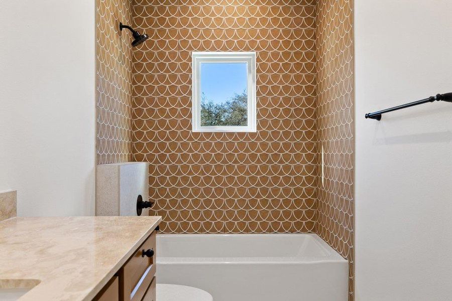 Full bathroom with shower / washtub combination and vanity