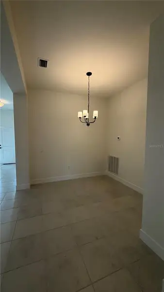 Spacious, unfurnished interior of a new home in Watercress Cove, North Port (Image 3).