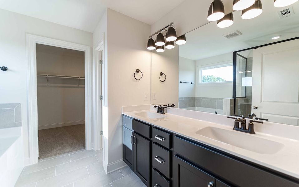 Furnished interior view inside a new home in Aden Woods, Fairview (Image 8).
