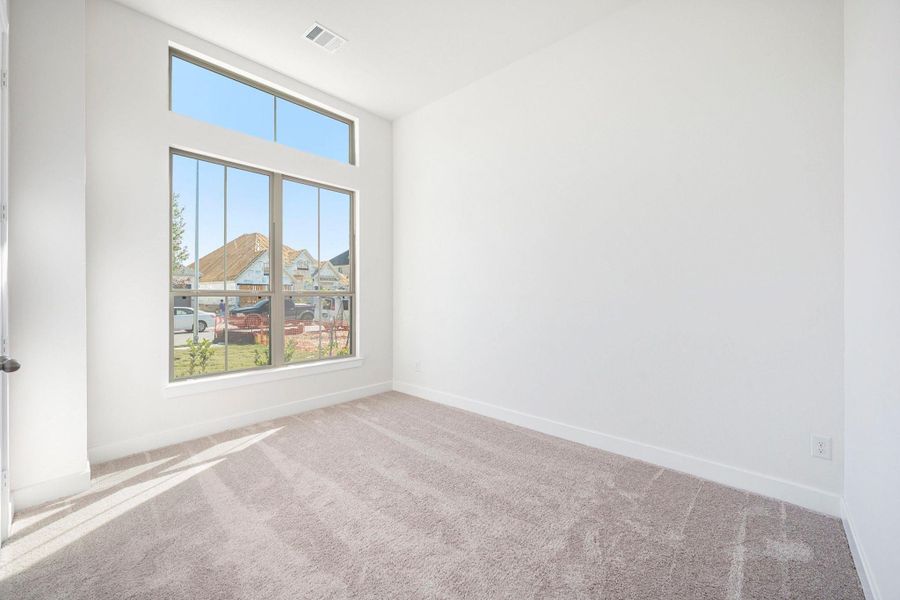 A spacious secondary bathroom is conveniently located outside of bedroom offering comfort and privacy for guests or family members. The well-appointed bath features stylish finishes and modern design, providing both function and elegance outside the primary suite.