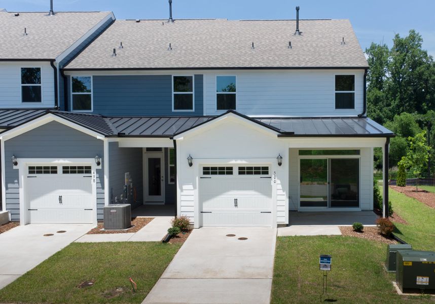 Front exterior of a new home in Enclave at Traditions Townhomes, Wake Forest, NC, highlighting curb appeal (Image 2).