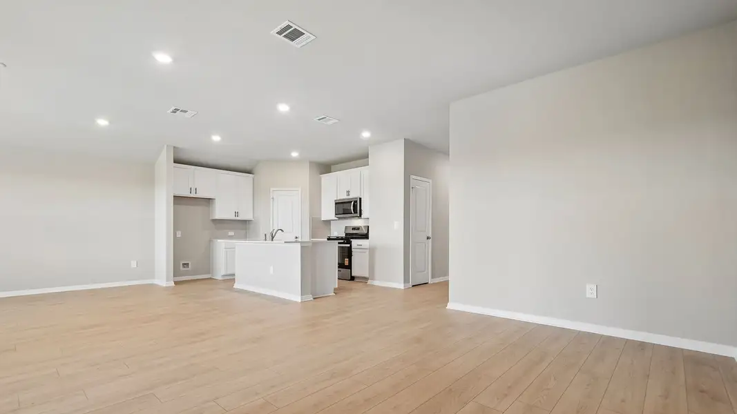Spacious, unfurnished interior of a new home in Carillon, Manor (Image 23).