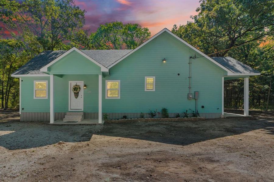 Front exterior of a new home in , Quinlan, TX, highlighting curb appeal (Image 18). Front exterior of a new home in , Quinlan, TX, highlighting curb appeal (Image 18).