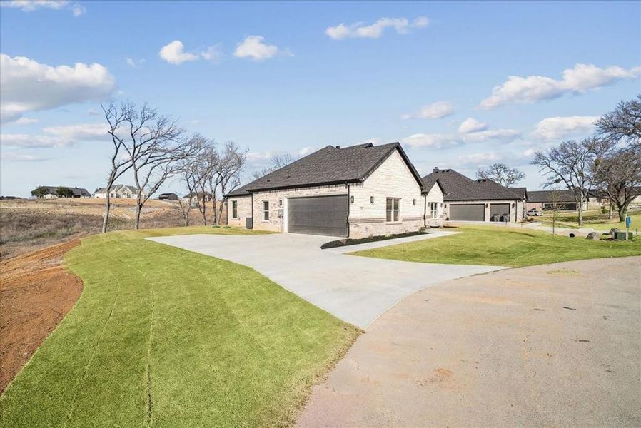 Front exterior of a new home in , Azle, TX, highlighting curb appeal (Image 26). Front exterior of a new home in , Azle, TX, highlighting curb appeal (Image 26).