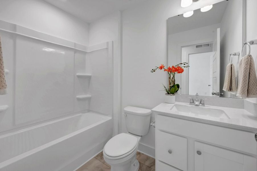 Furnished interior view inside a new home in Ashmore Townes, Garner (Image 27).