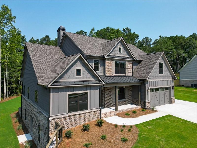 Front exterior of a new home in Spring Creek, Monroe, GA, highlighting curb appeal (Image 23). Front exterior of a new home in Spring Creek, Monroe, GA, highlighting curb appeal (Image 23).