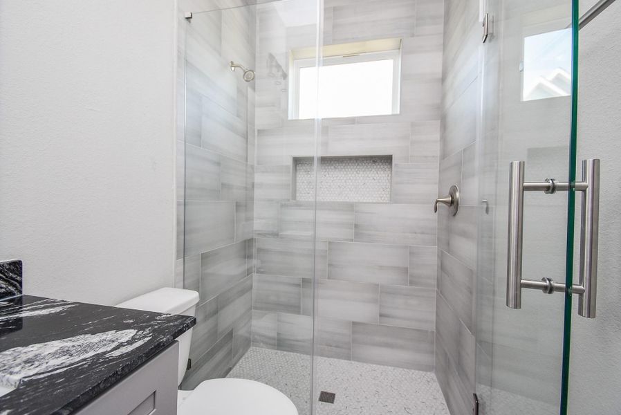 2nd bathroom shown here is conveniently located between the 2 secondary bedrooms!