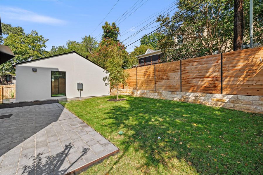 Fenced backyard featuring a patio