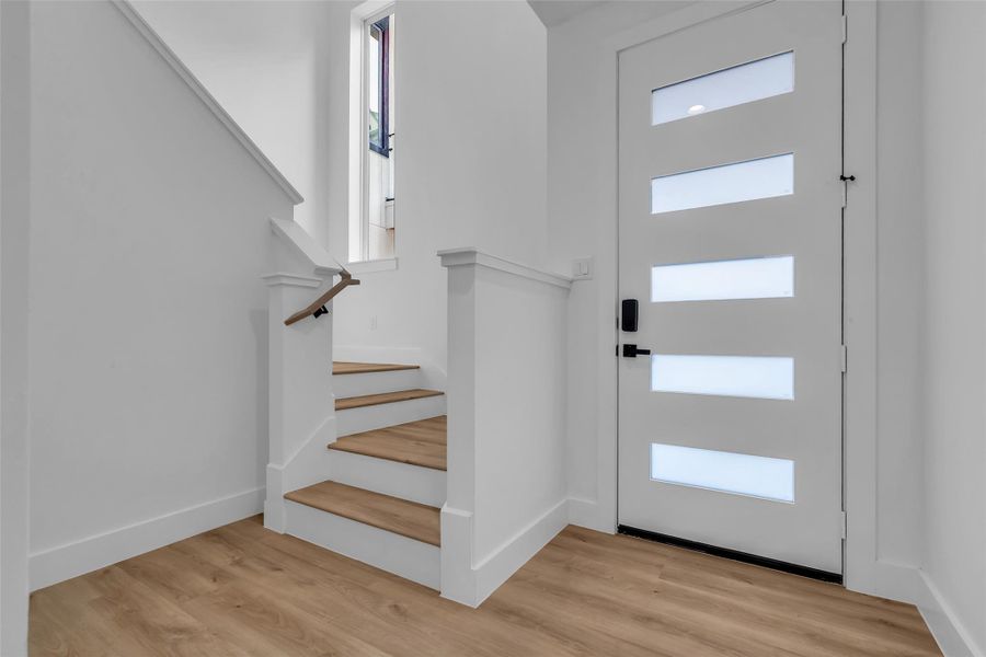 Step inside to a welcoming view of the main entrance from the foyer. Step inside to a welcoming view of the main entrance from the foyer.