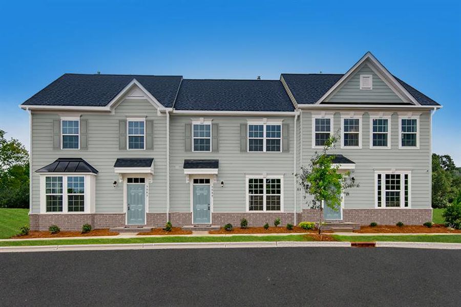 Front exterior of a new home in The Mills at Rocky River Townhomes, Concord, NC, highlighting curb appeal (Image 1). Front exterior of a new home in The Mills at Rocky River Townhomes, Concord, NC, highlighting curb appeal (Image 1).
