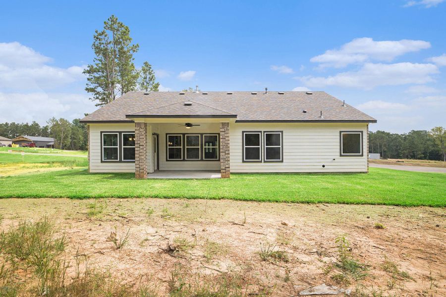 Front exterior of a new home in Oakwood Ranch, Willis, TX, highlighting curb appeal (Image 2). Front exterior of a new home in Oakwood Ranch, Willis, TX, highlighting curb appeal (Image 2).