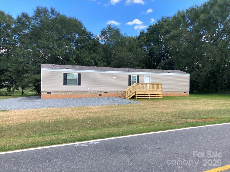 Front exterior of a new home in , Ellenboro, NC, highlighting curb appeal (Image 24).