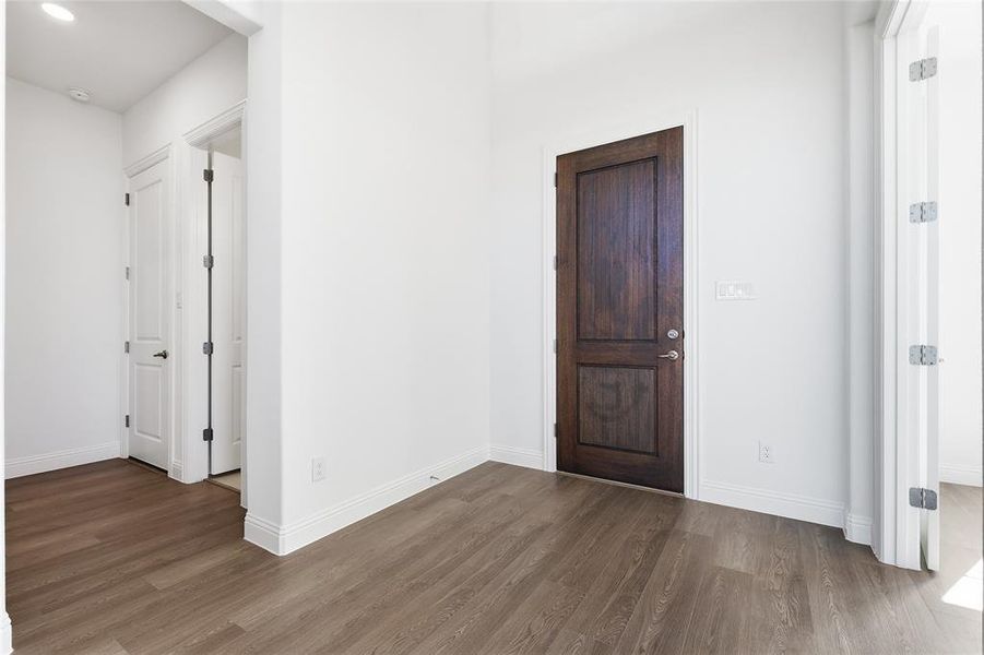 Foyer with dark wood finished floors Foyer with dark wood finished floors