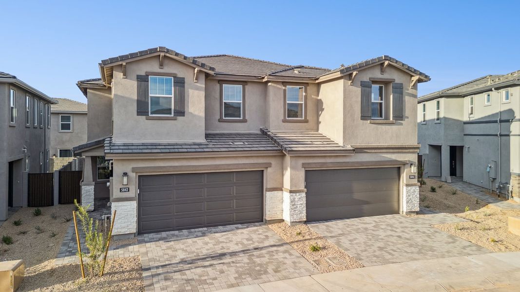 Front exterior of a new home in Talinn Towns at Desert Ridge, Phoenix, AZ, highlighting curb appeal (Image 2).