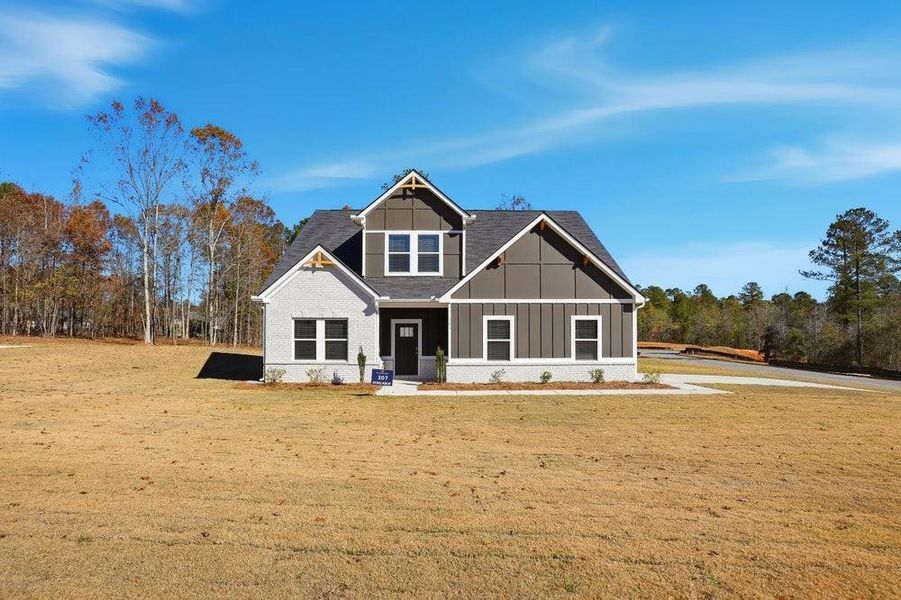 Front exterior of a new home in The Woodlands Preserve, Jackson, GA, highlighting curb appeal (Image 2). Front exterior of a new home in The Woodlands Preserve, Jackson, GA, highlighting curb appeal (Image 2).