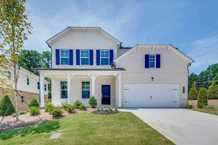 Front exterior of a new home in Oakmead, Buford, GA, highlighting curb appeal (Image 1).