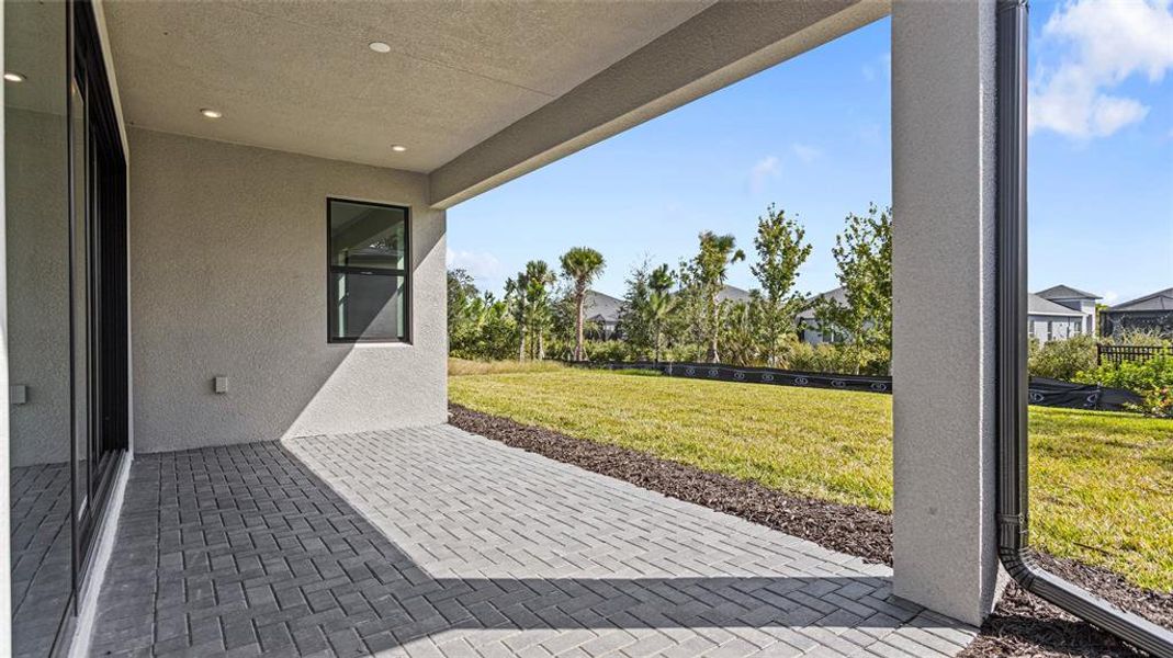 Exterior details and patio area of a home in Woodland Preserve, Parrish (Image 4).