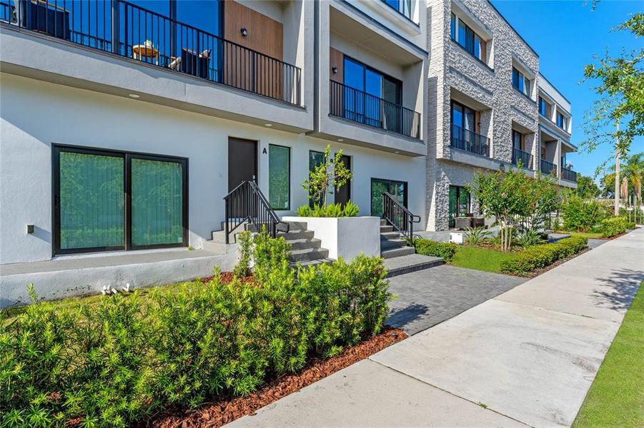 Front exterior of a new home in , Orlando, FL, highlighting curb appeal (Image 2).