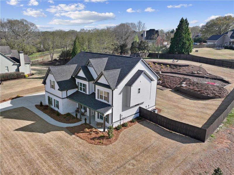 Front exterior of a new home in , Hoschton, GA, highlighting curb appeal (Image 26).