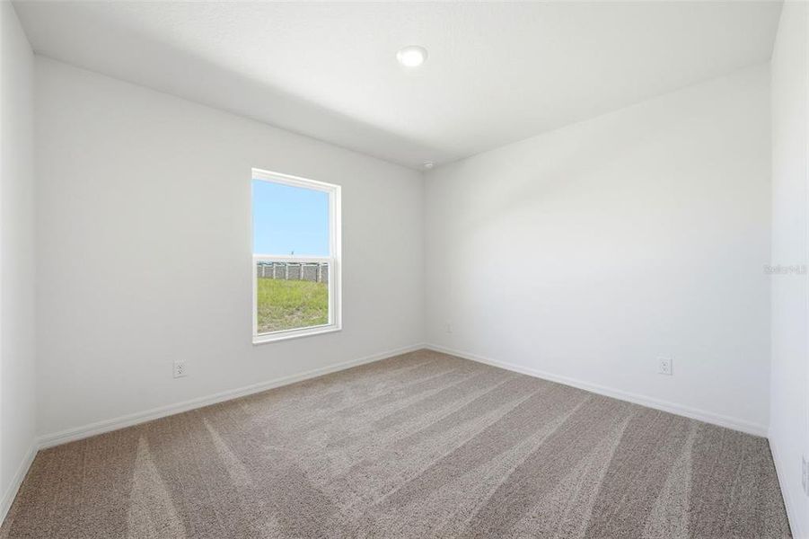 Spacious, unfurnished interior of a new home in Gum Lake Preserve, Lake Alfred (Image 26).