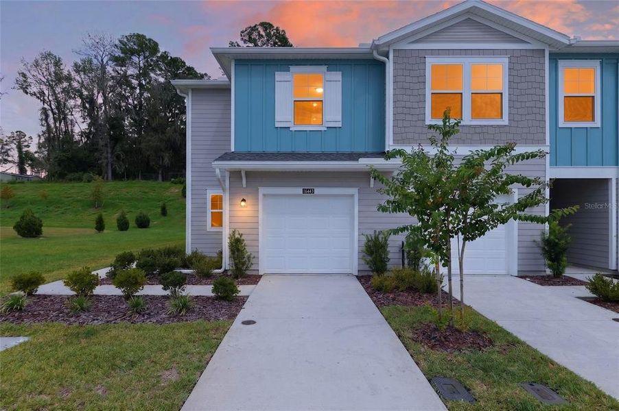 Front exterior of a new home in , Alachua, FL, highlighting curb appeal (Image 26).